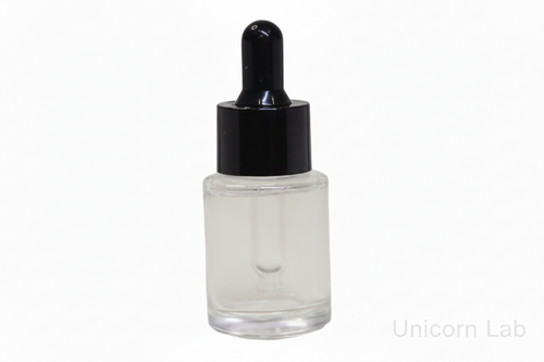 Clear 15ml glass flat shoulder dropper bottle with black cap on a white background