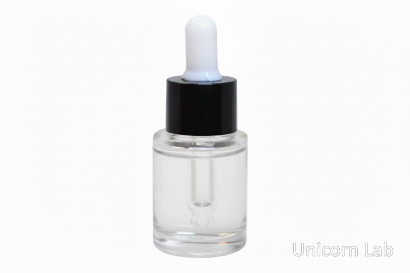 Clear dropper 15ml flat shoulder bottle with clear liquid on a white background