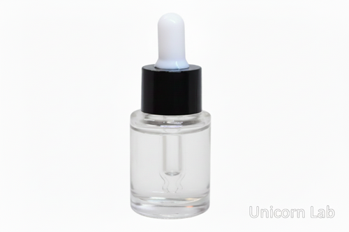 Clear dropper 15ml flat shoulder bottle with clear liquid on a white background