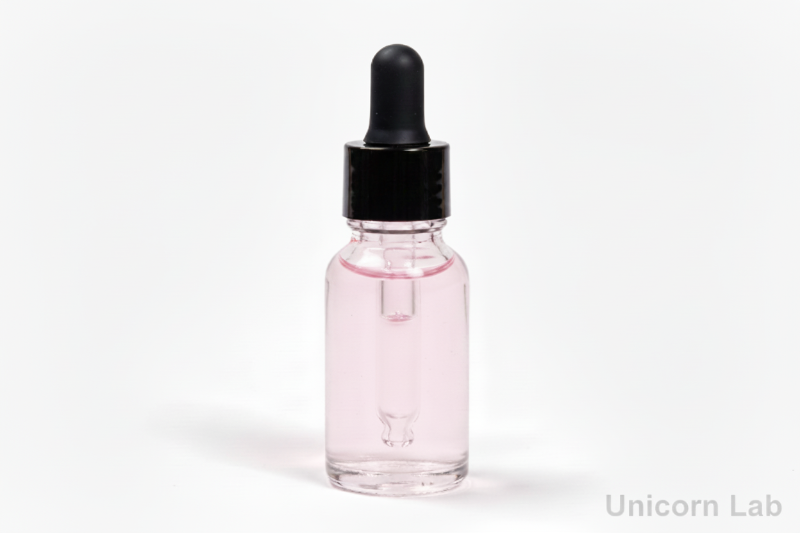 Clear glass 15ml round dropper bottle with black cap on a white background