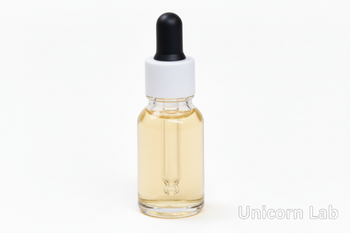 Clear 15ml round bottle with white cap on a white background with cuticle oil inside