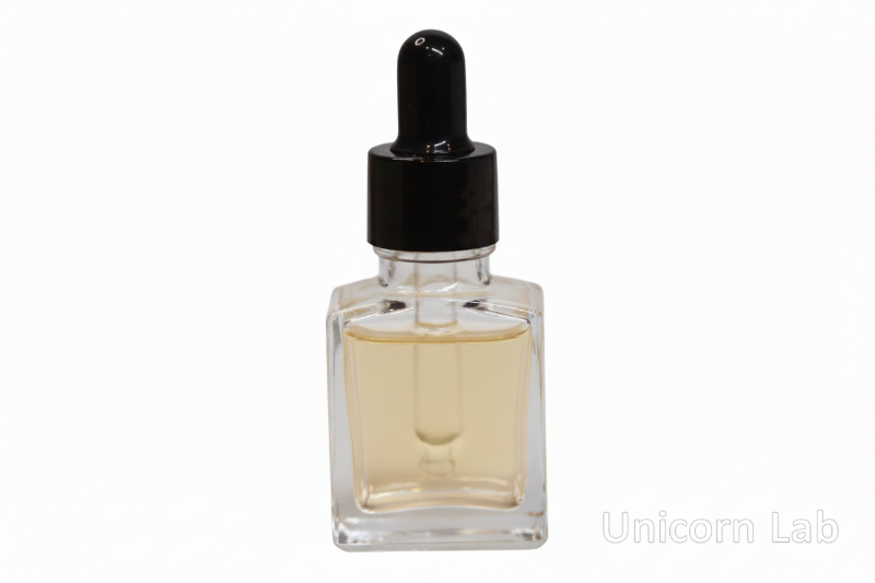 Clear glass 15ml square dropper bottle with black cap on a white background