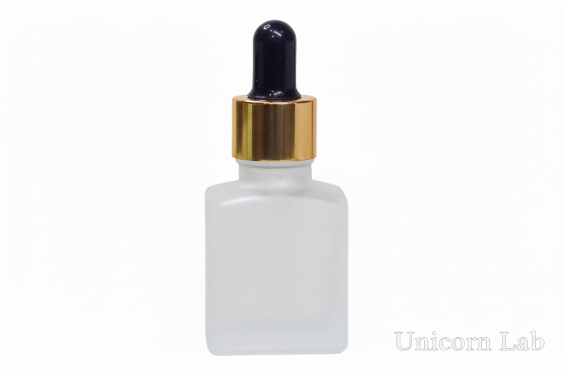 Frosted 15ml Square glass dropper bottle with gold cap on a white background
