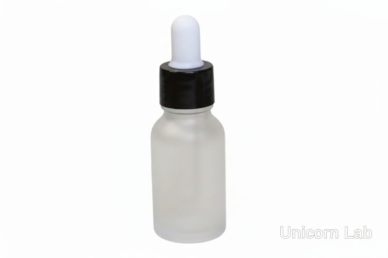 Frosted glass 15ml round dropper bottle with a black cap on a white background