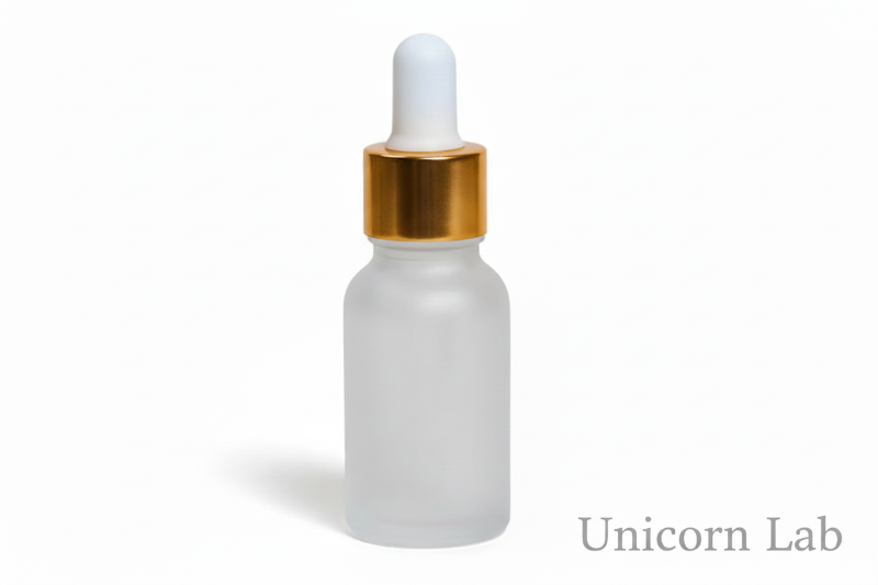 Frosted glass  15ml round dropper bottle with a gold cap on a white background for serums