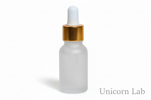Frosted glass  15ml round dropper bottle with a gold cap on a white background for serums