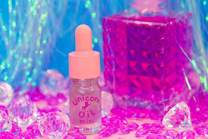 Sweet fantasy scented cuticle oil mini bottle with feminine aesthetic, hydrating nail serum