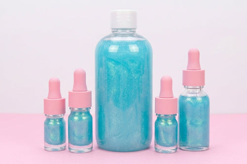 250 bulk cuticle oil refill in bubblegum scent with smaller dropper bottles.