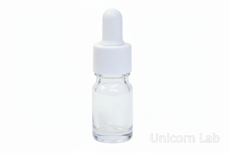 Clear glass  5ml dropper bottle with white cap on a white background