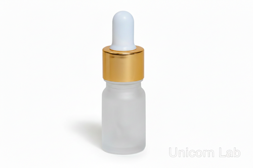 Frosted glass 5ml round dropper bottle with gold cap on a white background