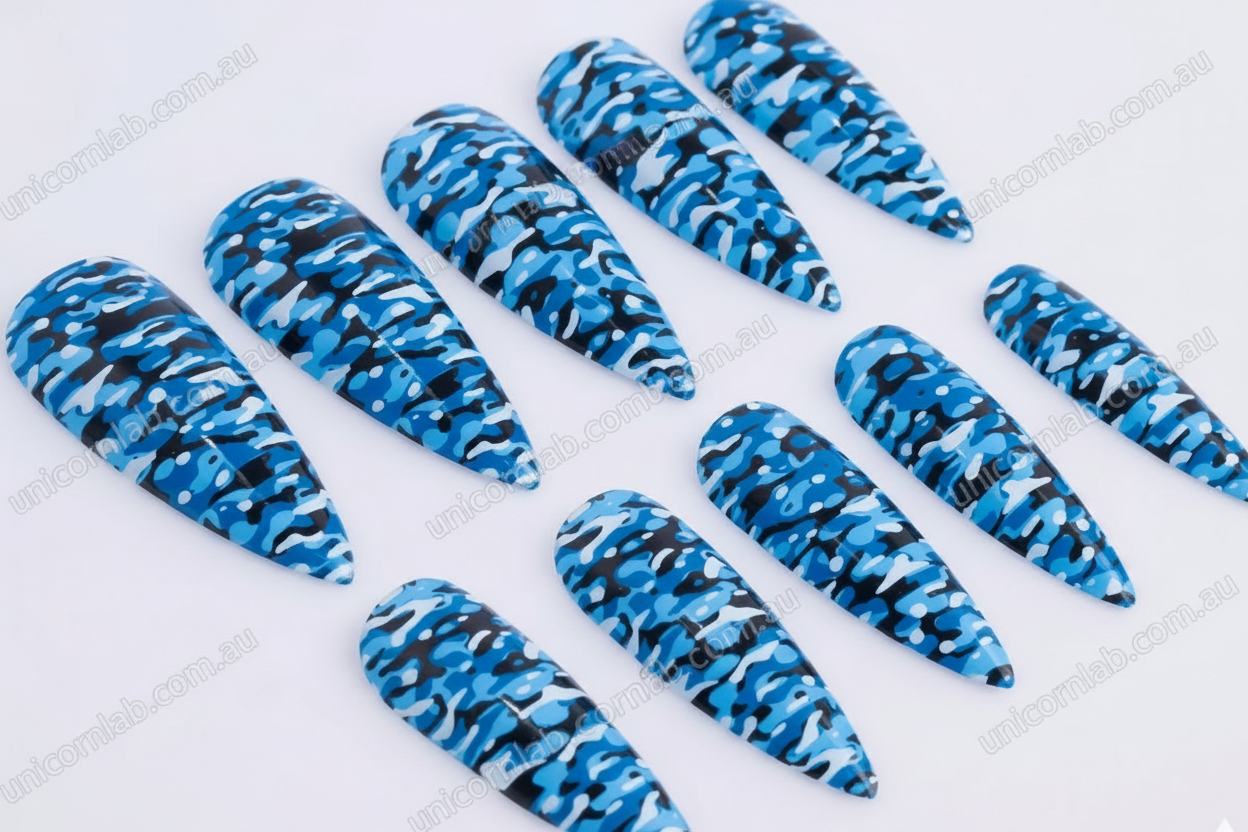 Blue and black camouflage pattern on stiletto nails - Unicorn Lab