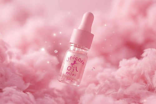 Fairy Floss scented Cuticle Oil 5ml mini bottle on a fluffy pink background