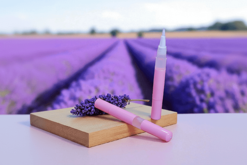 Lavender Aromatherapy Unicorn Cuticle Oil Pen over a field of Lavender - Unicorn Lab