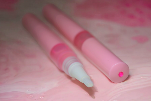 Peach cuticle oil pen with sliced peach aesthetic, non-greasy nail serum