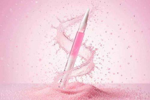 Pink sugar scented cuticle oil pen,  swirling in pink sugar crystals with sparkly nail oil inside. From the sweet tooth unicorn oil range at Unicorn Lab