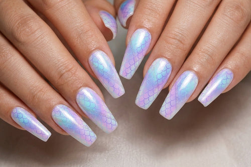 Close-up of hands with iridescent nail polish on a neutral background