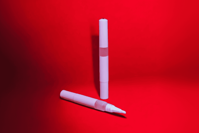 Red Skin cuticle oil pen with red lollies, sweet scented nail serum for dry nails