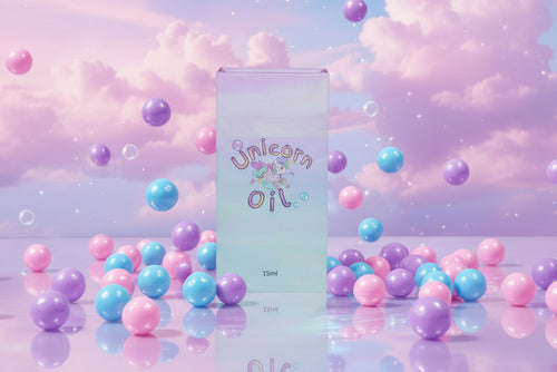 Bubblegum Unicorn Cuticle Oils luxury magnetic close style packaging surrounded by bubble and bubblegum falling. Product is in front of a pastel cloud sky - Unicorn Lab
