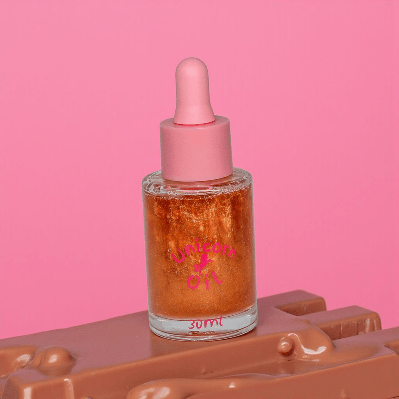 Chocolate Unicorn Cuticle Oil - Unicorn Lab sitting on top of melted chocolate.