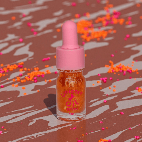 Chocolate Unicorn Cuticle Oil - Unicorn Lab - a 5ml scented nail serum over a chocolate drizzle background