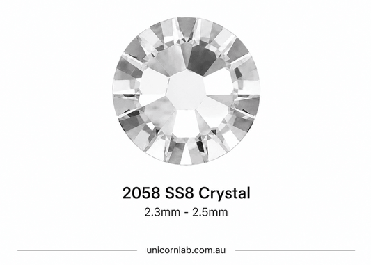 Crystal stone labeled '2058 SS8 Crystal' with size range '1.9mm - 2.1mm' on a white background. SS8 Crystal Flatback Nail Crystals | Genuine 2025 Rhinestones