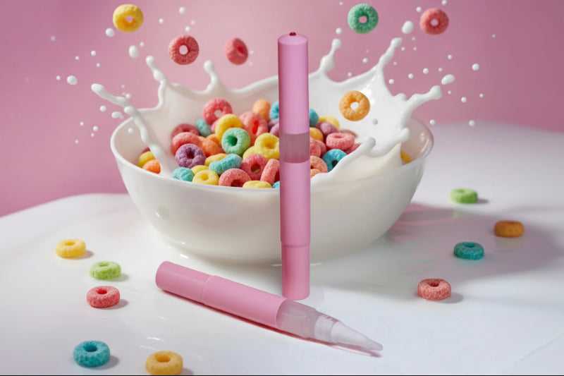 Fruit Loops cuticle oil pen splash in cereal bowl with milk, sweet scented nail serum for dry nails