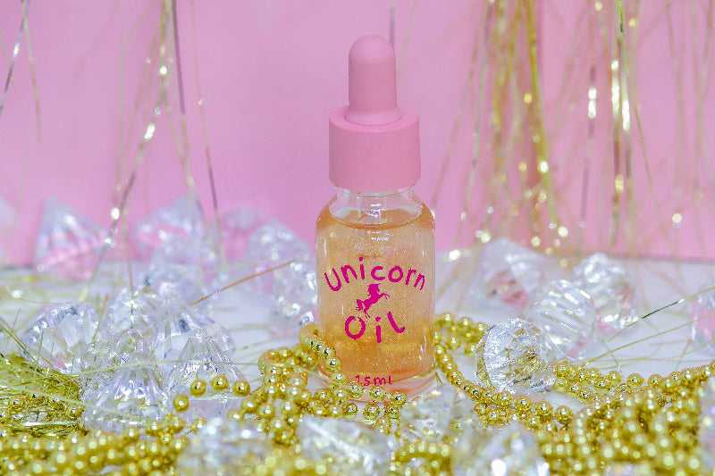 5ml glass bottle of Golden Hour Unicorn Cuticle Oil showcasing a premium nail 