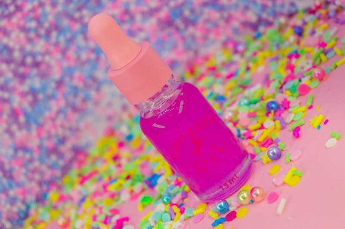 Tutti Frutti scented cuticle oil mini dropper with vibrant confetti scatter, lightweight nail serum