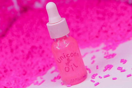 Pink sugar cuticle oil sample with soft pink candy styling, scented nail serum