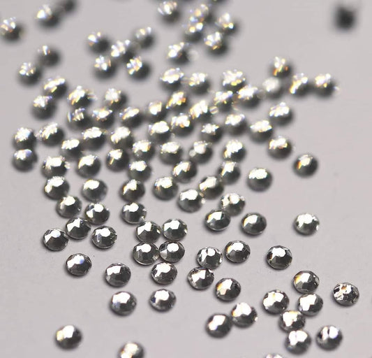 Bulk factory pack of Crystal SS4 (1.5mm) clear glass flatback rhinestones for professional nail art.